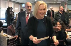  ?? NICHOLAS BUONANNO — DIGITAL FIRST MEDIA ?? U.S. Sen. Kirsten Gillibrand talks with guests at the Country View Diner as Troy Mayor Patrick Madden stands behind her.