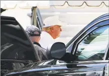  ?? Mandel Ngan / AFP via Getty Images ?? President Donald Trump walks from a SUV upon return to the White House in Washington on Saturday after spending the day at his Virginia golf club.