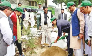  ?? Online ?? Imran Khan plants a sapling at the launch of ‘10 Billion Tree Tsunami’ green campaign. ■