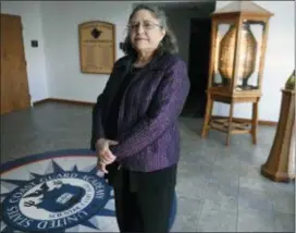  ?? JESSICA HILL — THE ASSOCIATED PRESS ?? Michele Fitzpatric­k, a retired lieutenant commander in the Coast Guard, poses for a photograph at the United States Coast Guard Academy in New London, Conn.