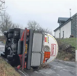 ?? Picture: Phil Hannah. ?? The Calor gas tanker lies on its side after the accident.