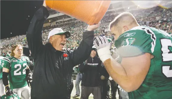  ?? TROY FLEECE ?? Back in 2009, Riders coach Ken Miller dumps Gatorade on Jeremy O’day, after the team clinched first place. O’day is now GM of the Riders, who again can clinch first today.