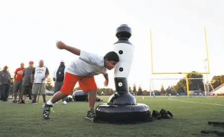  ?? Jim Gensheimer / Special to The Chronicle 2018 ?? Tackling drills like this one in San Jose will return to California fields, thanks to health guidelines updated by the state.