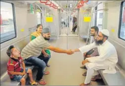  ??  ?? Passengers wearing a smile while commuting; children travelling with excitement and youngsters clicking selfies during the first day of the Metro run in city on Wednesday.