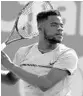  ?? AL BELLO/GETTY IMAGES ?? Frances Tiafoe, a 3-set winner, returns a shot against Konstanin Kravchuk.