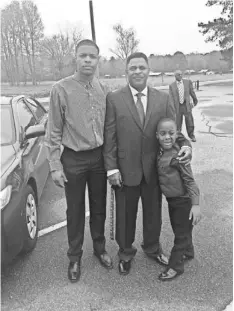  ?? SMITH FAMILY PHOTO ?? Dennis Smith Sr., center, with Dennis Jr., left, a top prospect, says, unlike LaVar Ball, he thinks he’d lose to Michael Jordan.