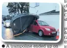  ??  ?? A trampoline ended up on top of a car in Henwalia, Caernarfon