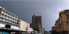  ??  ?? What Bulawayo expected to be rain only turned into a cold spell which forced many to wear heavy clothing. The picture taken in the central business district shows the dark clouds which usually precede rain. (Picture by Eliah Saushoma)