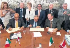  ?? FRANCESCO SORBARA /TWITTER ?? Councillor Vincent Crisanti (front left) signs the memorandum of understand­ing alongside Matera officials during the trip last year. MPs Judy Sgro and Francesco Sorbara stand in the centre back row.