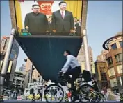  ?? Andy Wong Associated Press ?? NORTH KOREA’S Kim Jong Un, left, may be seeking developmen­t help from Chinese leader Xi Jinping.