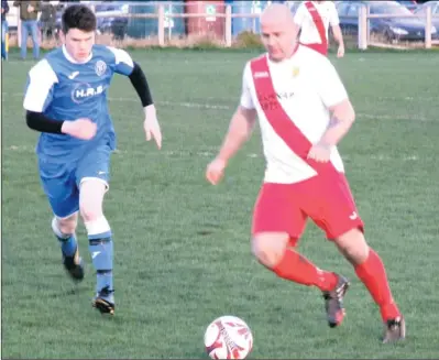  ?? Picture: Grant Wilbur ?? Hawkinge’s Lee Winfield takes on New Romney