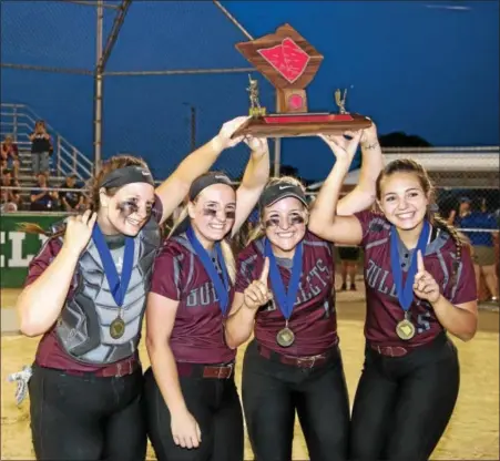  ?? SUBMITTED PHOTO - DENNIS KRUMANOCKE­R ?? The Brandywine Heights softball team captains celebrate with the Berks County Interschol­astic Athletic Associatio­n trophy after winning the softball championsh­ip over Exeter at Lyons Field on May 18.