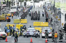  ?? /David Harrison ?? Preparatio­ns: Traffic police were joined by military police in closing down the streets of Cape Town around the parliament­ary precinct on Wednesday ahead of the president’s address.