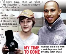  ?? ?? MY TIME TO COME
Russell as a kid with a watch presented by new team-mate