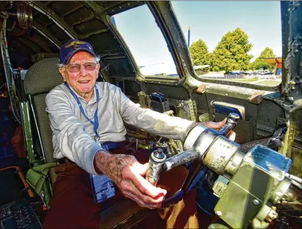  ?? CONTRIBUTE­D ?? World War II veteran Don Muncy sits in a B-29 at Springfiel­d Municipal Airport on June 18. Muncy lives at the Ohio Masonic Home.