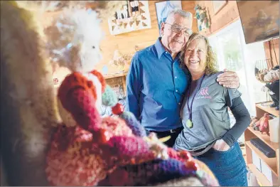  ?? MARK MIRKO | HARTFORD COURANT ?? Shirley Ernst, right, whose husband, Bob, lovingly refers to her as his trophy wife, makes “Floozy” dolls for people who donate to her walks. A floozy doll, she says, is “a colorful woman who thinks for herself, dresses any way she wants and doesn’t give a hoot about what others think of her.”