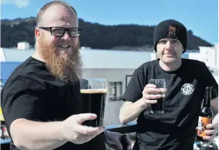  ?? PHOTO: CHRISTINE O’CONNOR ?? Saul Ross (left) and John Creighton, of One Six Five Brewing, with their 5.2% milk stout.