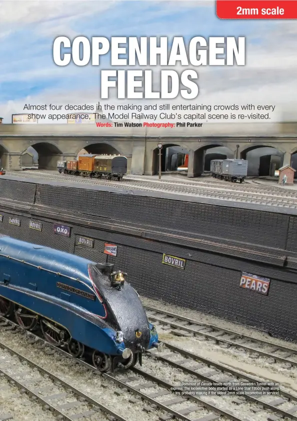  ??  ?? Dominion of Canada heads north from Gasworks Tunnel with an express. The locomotive body started as a Lone Star 1950s push along
toy, probably making it the oldest 2mm scale locomotive in service!