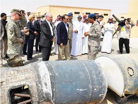  ??  ?? David Schenker, US assistant secretary of Near Eastern Affairs, being shown fragments of Iran-supplied missiles and intercepte­d drones at Al-Kharj air base.