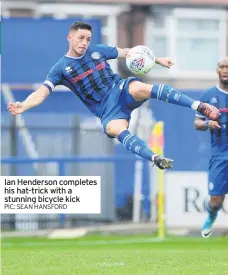  ??  ?? Ian Henderson completes his hat-trick with a stunning bicycle kick