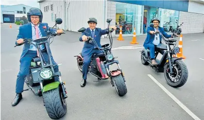  ?? Photo / Jamie Strange MP — Facebook ?? During his visit to Hamilton, Minister of Transport Michael Wood (centre) also had a go at riding an electric bike from EGO Bikes with local MPS Jamie Strange and Dr Gaurav Sharma.