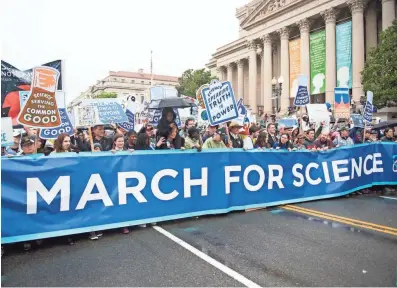  ?? PHOTOS BY JASPER COLT, USA TODAY ?? Marchers carry a banner at the head of the March for Science rally Saturday in Washington.