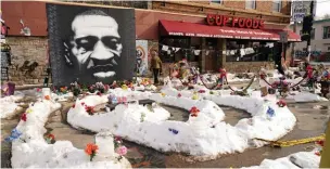  ?? Associated Press ?? ■ A mural of George Floyd is seen on Feb. 8 at George Floyd Square in Minneapoli­s. The city of Minneapoli­s on Friday agreed to pay $27 million to settle a civil lawsuit from George Floyd’s family over the man’s death in police custody, as jury selection continued in a former officer’s murder trial.