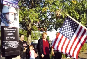  ?? NEWS-SENTINEL FILE PHOTOGRAPH ?? Kyle Coumas' mom Lori Coumas watches the ceremony as the Run for the Fallen passes through Lodi on Saturday, Oct. 12, 2019. Kyle Coumas was 22 when he was killed in the Kandahar province of Afghanista­n in 2009. With the U.S. pulling troops out of Afghanista­n after 20 years and the Taliban quickly overtaking the country, Lori and her husband Greg have had reason to reflect on the war and their son’s sacrifice.