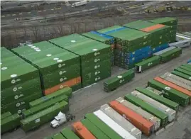  ?? E. JASON WAMBSGANS/CHICAGO TRIBUNE ?? Cargo containers stacked at the Norfolk Southern 47th Street intermodal yard on Friday.