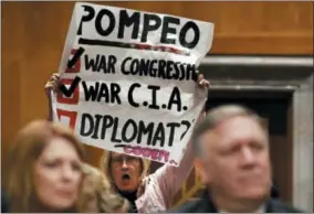  ?? JACQUELYN MARTIN — THE ASSOCIATED PRESS ?? Retired U.S. Army Col. Ann Wright, center, protests the nomination of CIA Director Mike Pompeo, front right, for secretary of state, as he waits to testify before the Senate Foreign Relations Committee during a confirmati­on hearing on his nomination to...