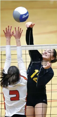  ??  ?? General Amherst’s Allison Dufour hits against Reese Corcoran of Burlington Corpus Christi in OFSAA girls volleyball pool play on Monday. General Amherst needs a win in their game today to earn a quarter-final spot.