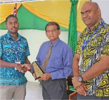  ??  ?? From Left: Representa­tive from Fiji Sugar Corporatio­n collected gold awards on behalf of the company from the Labasa and Savusavu town council Special Administra­tor Vijay Chand as he stands with National Training and Productivi­ty Centre director...