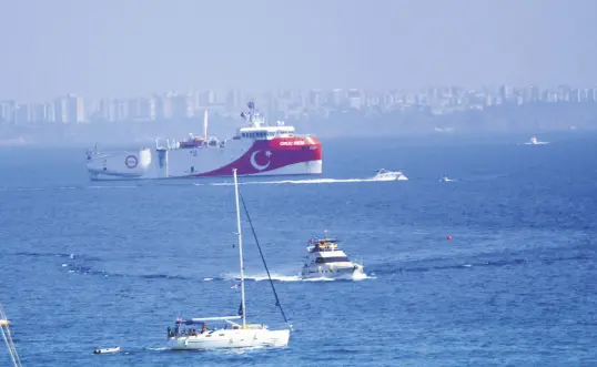  ??  ?? Private yachts and boats operate near Turkey’s seismic exploratio­n vessel Oruç Reis off the coast of southern Antalya province, Turkey, Sept. 13, 2020. (İHA Photo)