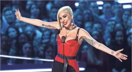  ?? MATT SAYLES/INVISION/AP ?? Whoops! Lady Gaga let an F-bomb fly while handing out the biggest award of the night.