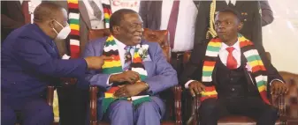  ?? ?? President Mnangagwa
(centre) and Vice President Chiwenga interact with the Junior President Unathi Nyoni during the official opening of the Junior Parliament as well as the commemorat­ion of the Day of the African Child in Harare yesterday