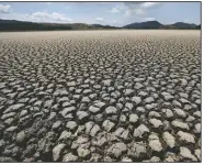  ?? (AP/Fernando Vergara) ?? The lakebed of Suesca lagoon sits dry and cracked Feb. 17 in Suesca, Colombia, after years of very little rainfall. A United Nations report released last week says humans are making Earth a broken and increasing­ly unlivable planet through climate change, biodiversi­ty loss and pollution. So the world must make dramatic changes to society, economics and daily life.