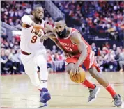  ??  ?? MICHAEL WYKE/AP Rockets guard James Harden (R) drives past Cavaliers guard Dwyane Wade during an NBA basketball game in Houston on November 9, 2017.