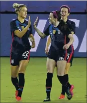  ?? PHELAN M. EBENHACK — THE ASSOCIATED PRESS ?? Kristie Mewis, left, gets a high-five Wednesday from Rose Lavelle after her goal during the U.S. women’s win.