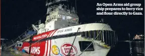  ?? ?? An Open Arms aid group ship prepares to ferry rice and flour directly to Gaza.