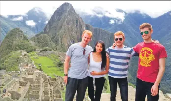  ??  ?? Taking time out to explore the sights, from left to right, Michael Fee, with girlfriend Carla, and brothers Eryn and Joel Fee at the ancient Incan village of Macchu Picchu, deep in the Andes.