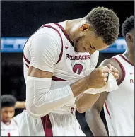  ??  ?? NWA Democrat-Gazette/BEN GOFF Arkansas’ Daniel Gafford leaves the floor after missing a last-second shot in the Razorbacks’ 78-77 loss to Western Kentucky on Saturday. See more photos at arkansason­line.com/galleries