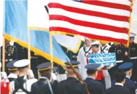  ?? KIM HONG-JI/POOL PHOTO VIA AP ?? A soldier carries a casket containing the remains of a U.S. soldier who was killed in the Korean War during a ceremony at Osan Air Base in Pyeongtaek, South Korea, on Friday.