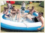  ??  ?? WHAT NO MUD? Glastonbur­y pool party