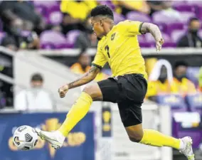  ?? (Photo: AFP) ?? Jamaica’s Leon Bailey jumps for the ball during the Gold Cup Prelims football match against Suriname at the Exploria Stadium in Orlando, Florida, on Monday.