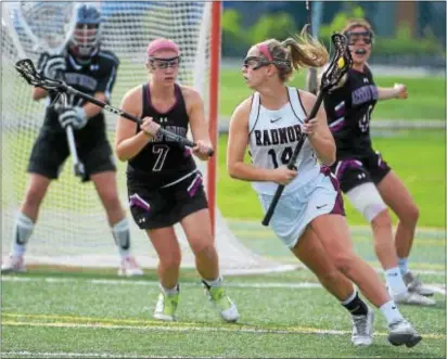  ?? PETE BANNAN — DIGITAL FIRST MEDIA ?? Radnor’s Julianne Puckette, No. 14, seen here against Garnet Valley’s Kamryn McNeal, 7, goalie Lauren Kinnee and Tish Minford, has used past injury frustratio­ns as motivation as she and the Raiders approach Class 2A state title game.