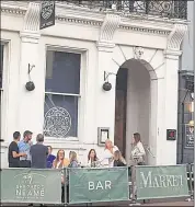  ?? ?? Pizza Express in Earl Street Maidstone is to close. Right: People visiting the Market House pub next door sit in front of the restaurant, which is still shut after lockdown