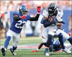  ?? Alex Trautwig / Getty Images ?? Broncos tight end Noah Fant picks up a first down against the Giants on Sunday at Metlife Stadium in East Rutherford, N.J.