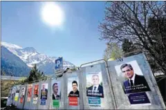  ?? PIERRE CLATOT/AFP JEAN ?? Campaign posters for the French presidenti­al election candidates.