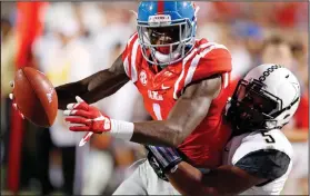  ??  ?? Mississipp­i wide receiver Laquon Treadwell (1) is tackled short of a touchdown after a pass reception against Vanderbilt cornerback Torren McGaster (5) during the first half of an NCAA college football game Saturday, Sept. 26, 2015, in Oxford, Miss.