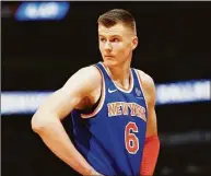  ?? David Zalubowski / Associated Press ?? Then-Knicks forward Kristaps Porzingis reacts after fouling out against the Nuggets in a 2018 game.